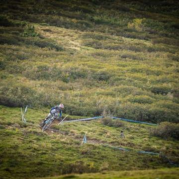 Orange Team Rider on open trail