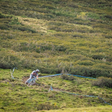 Orange Team Rider on open trail