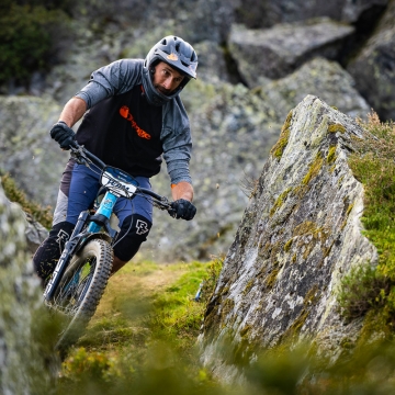 Dan Greenwood riding through rocks